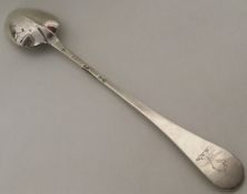 A massive George I silver hash spoon with rat tail
