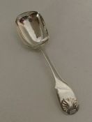 A fiddle pattern silver jam spoon. London. By WK&S