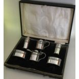 A good quality cased Edwardian silver cruet set. B