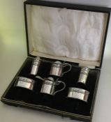 A good quality cased Edwardian silver cruet set. B