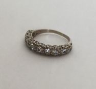 A good diamond half eternity ring in rubover mount