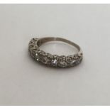 A good diamond half eternity ring in rubover mount