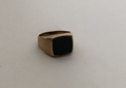 A heavy large gent's 9 carat signet ring. Approx.