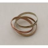 A 9 carat three colour trio of rings. Approx. 3.9