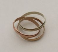 A 9 carat three colour trio of rings. Approx. 3.9
