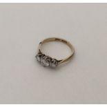 An attractive diamond three stone ring in platinum