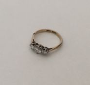 An attractive diamond three stone ring in platinum