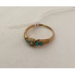 A turquoise and pearl ring with chased decoration.