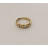 An Antique diamond three stone gypsy set ring in 1