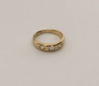 An Antique diamond three stone gypsy set ring in 1