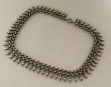 A Victorian silver collar with matching drop decor