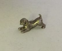 A miniature Continental silver figure of a playing