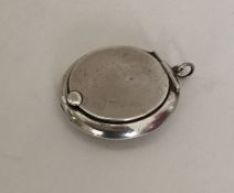 An Edwardian silver miniature compact with hinged