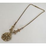 An Edwardian 15 carat gold pendant set with half p