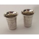 A pair of silver Kiddish cups of tapering forms. A