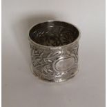 A Chinese silver napkin ring decorated with bamboo