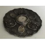 An unusual Turkish circular silver dish decorated