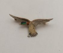 An attractive 9 carat three colour gold brooch in