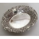 A heavy silver bonbon dish decorated with winged i