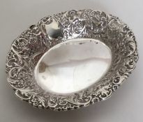A heavy silver bonbon dish decorated with winged i