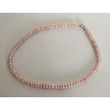 A silver mounted pearl necklace. Approx. 31 grams.