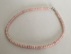 A silver mounted pearl necklace. Approx. 31 grams.