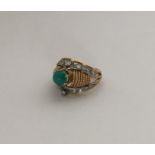 An 18 carat two colour gold diamond and turquoise