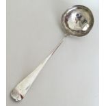A large silver soup ladle with crested terminal. L