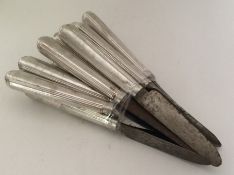 A set of six Georgian silver knives with steel bla