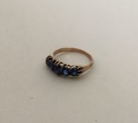 A good sapphire five stone tapering half hoop ring