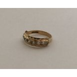 A small 9 carat and gem stone half eternity ring.