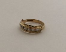 A small 9 carat and gem stone half eternity ring.