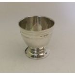 An unusual stylish engine turned silver egg cup. B