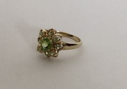 A 9 carat peridot cluster ring in claw mount. Appr