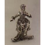 A heavy Continental silver figure of a seated chil