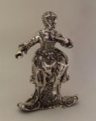 A heavy Continental silver figure of a seated chil