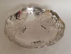 A stylish silver pierced dish with shaped edge. Sh