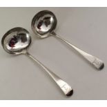 A pair of George III silver sauce ladles. London 1