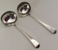 A pair of George III silver sauce ladles. London 1