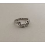 A good diamond four stone ring of oval form in 18