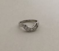A good diamond four stone ring of oval form in 18