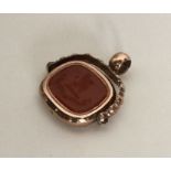 A large oval spinning fob with crested intaglio de