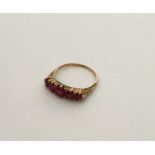 An 18 carat ruby five stone tapering ring in claw