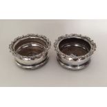 A pair of silver plated bottle coasters. Est. £10