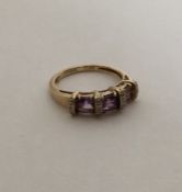 An amethyst and diamond Art Deco style ring in cla