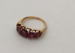 A large graduated five stone ruby ring in 18 carat