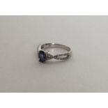 A diamond and tanzanite weave ring in claw mount.