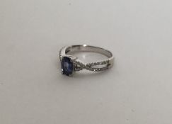 A diamond and tanzanite weave ring in claw mount.