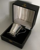 An Edwardian silver christening cup contained with