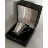 An Edwardian silver christening cup contained with